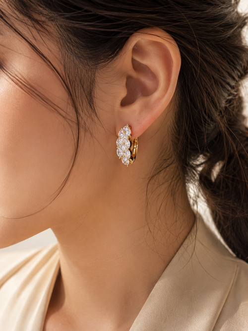 Celeste Bloom Hoops worn on model – marquise CZ gold huggie earrings